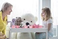 A mom and toddler daughter having a tea party. Royalty Free Stock Photo