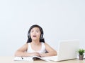 Little girl doing online class