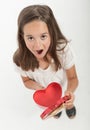 Little girl with heart shaped gift box Royalty Free Stock Photo