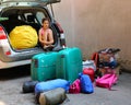 Little girl with hearts dress loads the baggage car