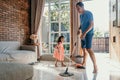 Little girl help her daddy to do chores