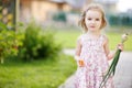 Little girl helping in a garden