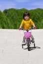 Little girl with her bicycle