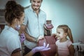 Little girl with her father at dentist office. Royalty Free Stock Photo