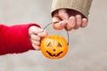 Little girl and her father, Halloween, parent and child trick or treating together. Toddler kid with jack-o-lantern. Royalty Free Stock Photo