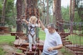 Little girl with her father overcomes an obstacle. Royalty Free Stock Photo