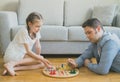 Family playing ludo.