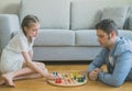 Family playing ludo.