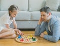 Family playing ludo.