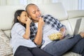 Child and father watching a movie on a laptop