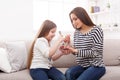 Little girl and her mom eating a salad at home Royalty Free Stock Photo