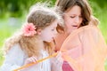 Little girl and her mother with butterfly net Royalty Free Stock Photo