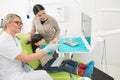 Little girl with her mother at dentist's office Royalty Free Stock Photo