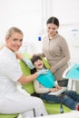 Little girl with her mother at dentist's office