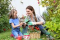 Little girl and her mother gardening Royalty Free Stock Photo