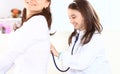 Little girl with her mother played in doctors. Royalty Free Stock Photo