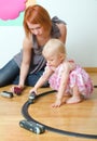 Little girl and her mother playing Royalty Free Stock Photo