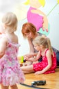 Little girl and her mother playing Royalty Free Stock Photo