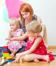 Little girl and her mother playing Royalty Free Stock Photo