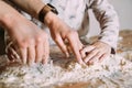 A little girl with her mother prepares the dough for baking Royalty Free Stock Photo