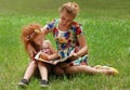 Little girl and her mother read book Royalty Free Stock Photo