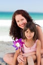 Little girl and her mother with a windmill Royalty Free Stock Photo