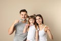 Little girl and her parents brushing teeth together Royalty Free Stock Photo