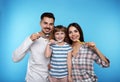 Little girl and her parents brushing teeth together Royalty Free Stock Photo