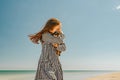 Girl and Chihuahua. A little girl with her pet chihuahua dog. Concept sea vacation girl and dog Royalty Free Stock Photo