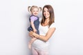 Little girl with her pregnant mother in studio Royalty Free Stock Photo