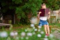 Little girl hiding behind book Royalty Free Stock Photo