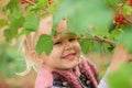 Little girl hiding behind the foliage Royalty Free Stock Photo