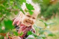 Little girl hiding behind the foliage Royalty Free Stock Photo