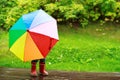 Little girl hiding behind umbrella Royalty Free Stock Photo