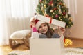 Little girl hiding inside huge Christmas present Royalty Free Stock Photo