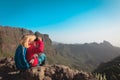 Little girl hiking in mountains looking at binoculars, famly travel Royalty Free Stock Photo