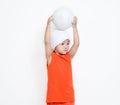 Little girl hold her ball on her head. Royalty Free Stock Photo