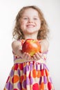 Little girl holding an apple