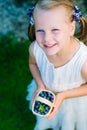 Little girl holding a basket of blueberries - shallow depth of f Royalty Free Stock Photo