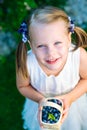 Little girl holding a basket of blueberries - shallow depth of f Royalty Free Stock Photo