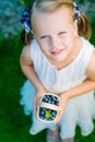 Little girl holding a basket of blueberries - shallow depth of f Royalty Free Stock Photo