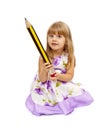 Little girl holding big pencil Royalty Free Stock Photo