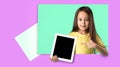 little girl holding a blank tablet computer Royalty Free Stock Photo