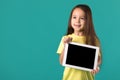 Little girl holding a blank tablet computer Royalty Free Stock Photo