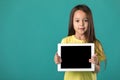 Little girl holding a blank tablet computer Royalty Free Stock Photo