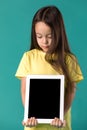 Little girl holding a blank tablet computer Royalty Free Stock Photo