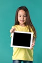 Little girl holding a blank tablet computer Royalty Free Stock Photo