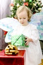 Little girl holding christmas gift Royalty Free Stock Photo