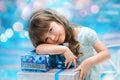 Little girl holding christmas gift Royalty Free Stock Photo