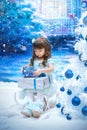 A little girl holding christmas gift Royalty Free Stock Photo
